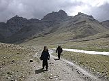 Tibet Kailash 08 Kora 21 Walking Towards Dirapuk in the Hail It took a little over an hour to trek from Tamdrin to our overnight stop across the valley from Dirapuk. The weather turned fairly nasty, with rain turning to hail, and then the sun broke through.